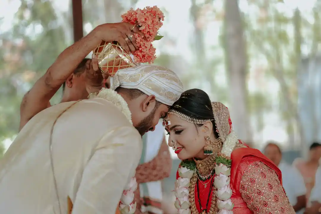 Bride and groom during traditional wedding ritual planned by Best Wedding Planners in Bangalore