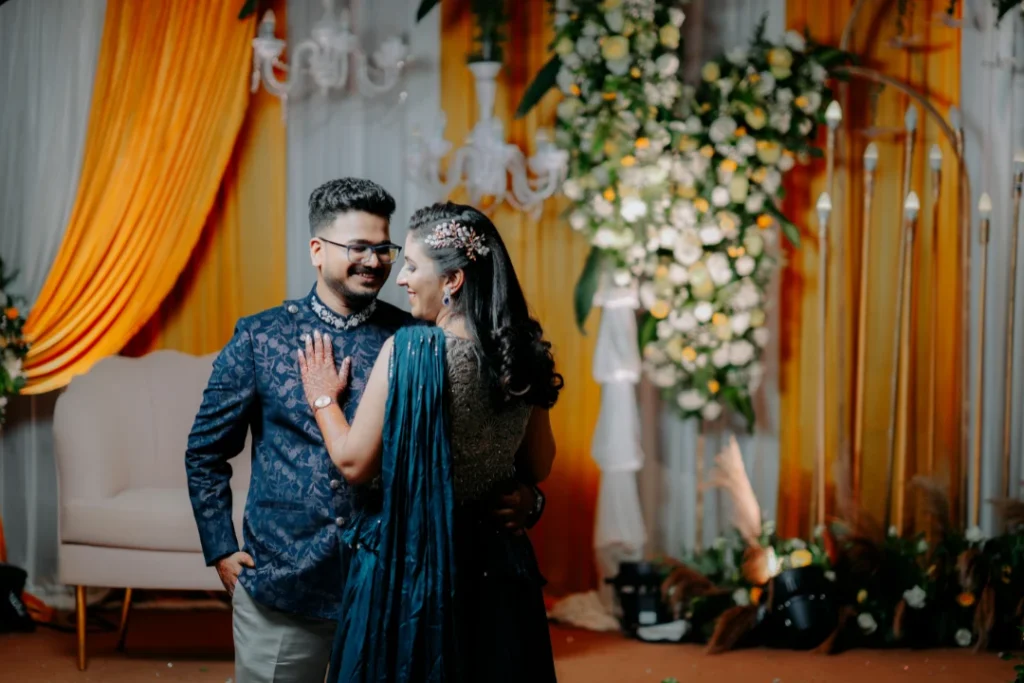 Couple portrait during Bangalore wedding with floral backdrop - best wedding decoration in bangalore