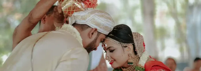 Bride and groom during traditional wedding ritual planned by Best Wedding Planners in Bangalore